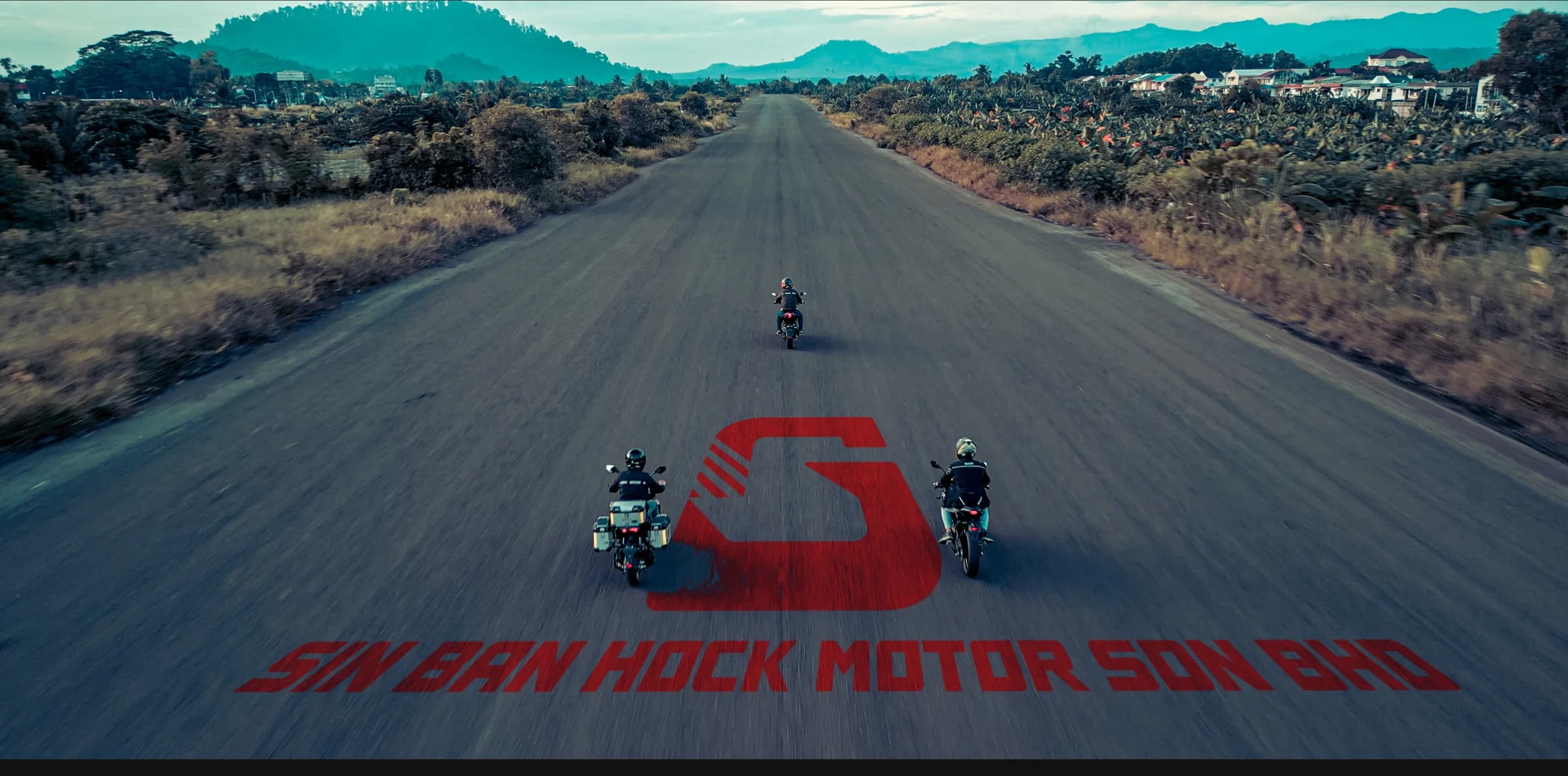 Motorcyclists riding on an open road in Sabah
